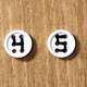 Illustration for article titled Extra Hole Buttons Let You Spell Out Messages On Your Clothing
